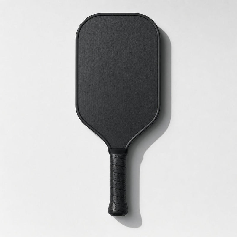 Black carbon pickleball paddle seen from the front