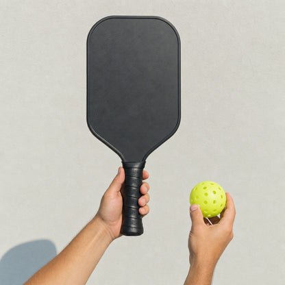 Dinkwell Carbon Paddle - 11 scale in hand