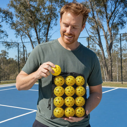 Dinkwell Outdoor Pickleballs 12-pack - h01 holding
